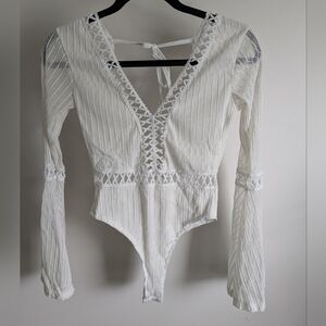 Elegant White Lace-Up Bodysuit